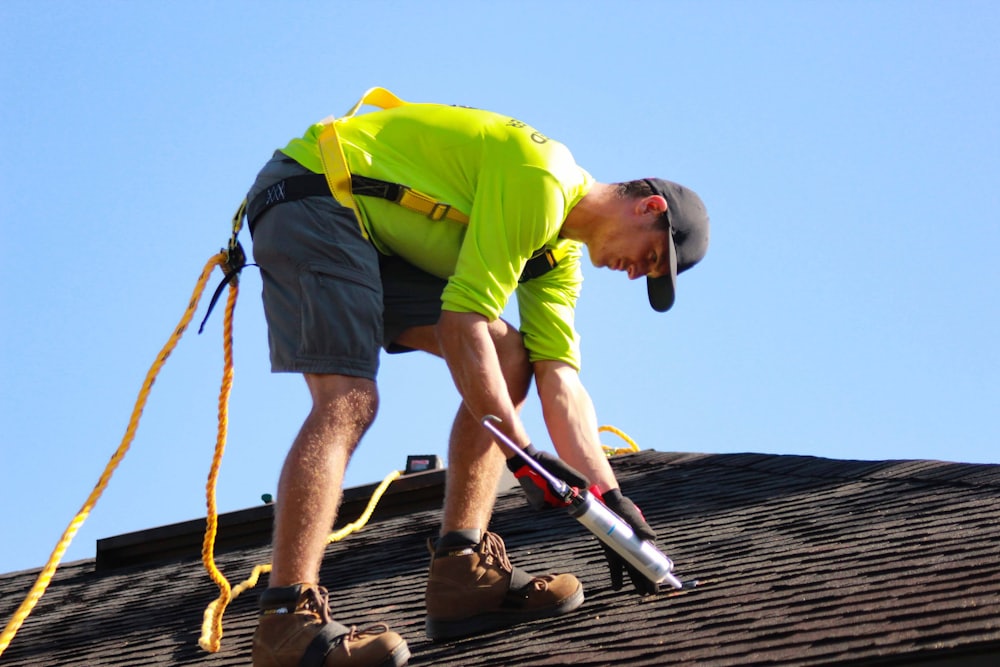 Lightstream Roofing technician inspecting asphalt shingles on a home in Cleveland, Ohio