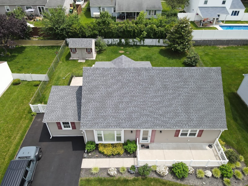 Aerial view of a residential asphalt shingle roof during a roof inspection